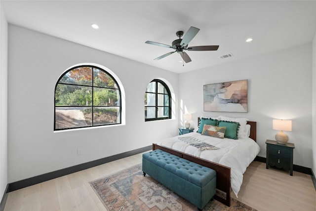 bedroom featuring light wood-type flooring and ceiling fan