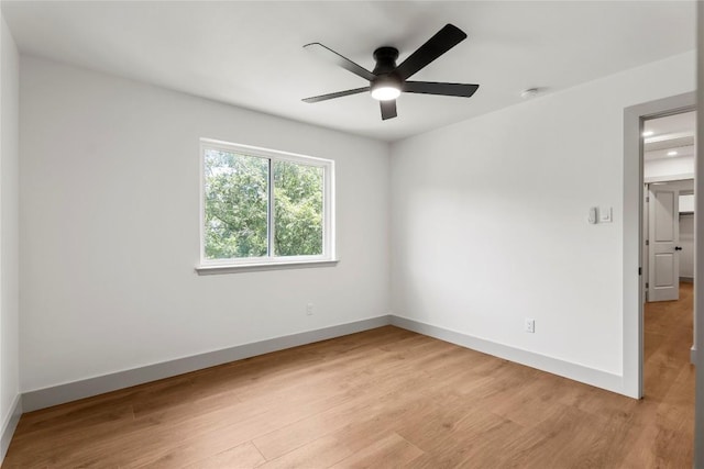 spare room with ceiling fan and light hardwood / wood-style flooring