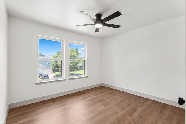 unfurnished room with ceiling fan and light wood-type flooring