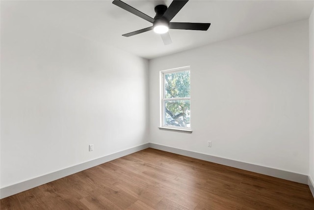 empty room featuring hardwood / wood-style floors and ceiling fan