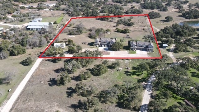 5217/5215 Bell Springs Rd, Dripping Springs, TX 78620 - birds eye view of property featuring a rural view