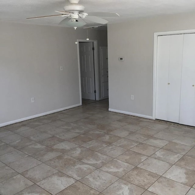 5217/5215 Bell Springs Rd, Dripping Springs, TX 78620 - spare room featuring baseboards and a ceiling fan