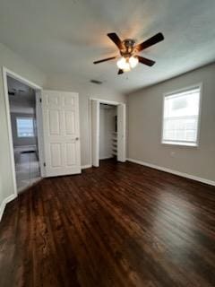 5217/5215 Bell Springs Rd, Dripping Springs, TX 78620 - unfurnished bedroom featuring a ceiling fan, baseboards, and wood finished floors