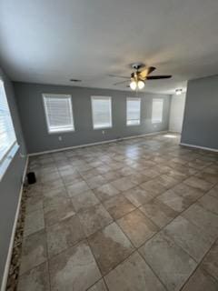 5217/5215 Bell Springs Rd, Dripping Springs, TX 78620 - unfurnished room with baseboards and ceiling fan