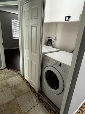 5217/5215 Bell Springs Rd, Dripping Springs, TX 78620 - washroom featuring light tile patterned floors, washer and clothes dryer, and laundry area