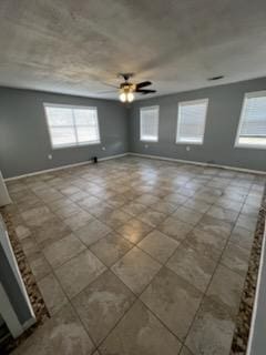 5217/5215 Bell Springs Rd, Dripping Springs, TX 78620 - empty room with baseboards and ceiling fan