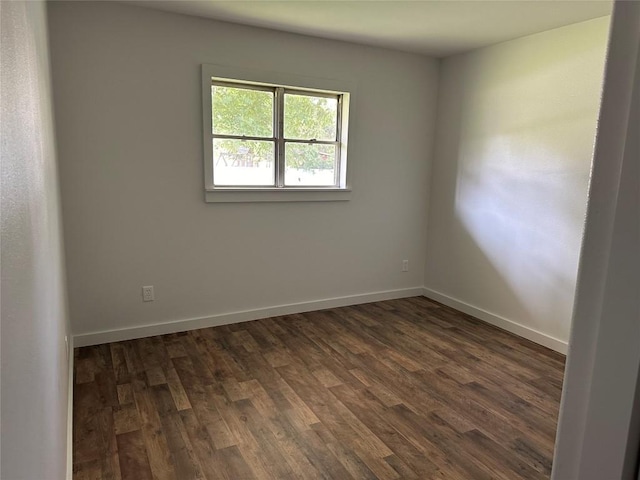 spare room featuring dark hardwood / wood-style flooring