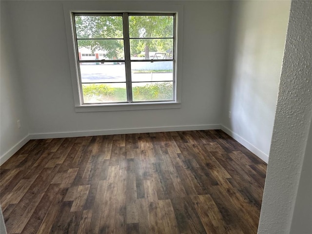 empty room featuring dark wood-type flooring