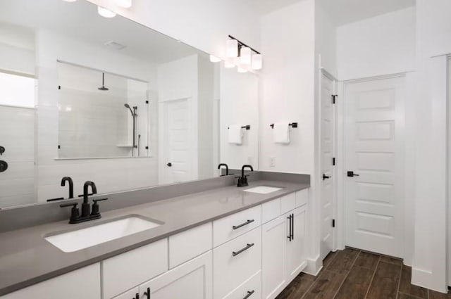 bathroom featuring vanity and walk in shower