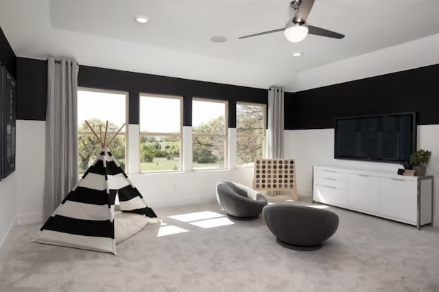 sitting room featuring ceiling fan and light colored carpet