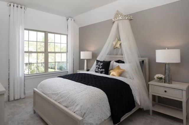 carpeted bedroom featuring lofted ceiling