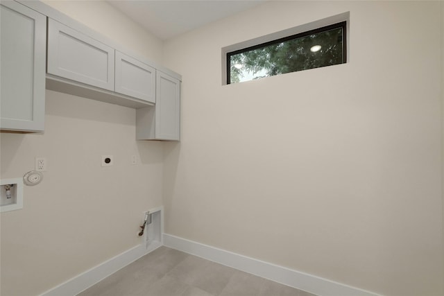 laundry room featuring hookup for a gas dryer, cabinets, washer hookup, and hookup for an electric dryer