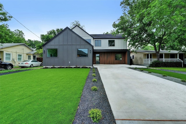 modern farmhouse featuring a front yard