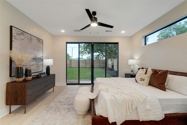 bedroom featuring light wood-type flooring, access to outside, and ceiling fan