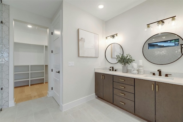 bathroom with tile patterned flooring and vanity