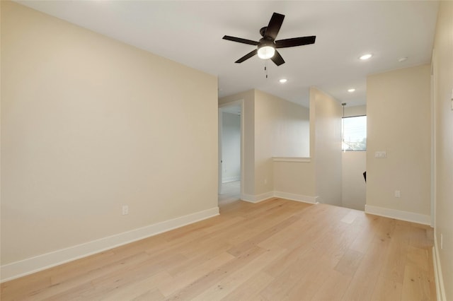 unfurnished room featuring ceiling fan and light wood-type flooring