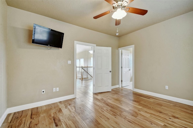 unfurnished room featuring ceiling fan and light hardwood / wood-style floors