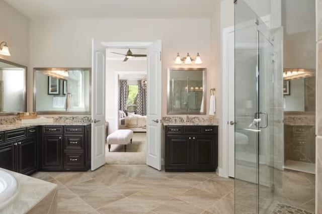 bathroom featuring vanity, ceiling fan, and a shower with shower door