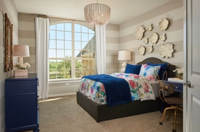 bedroom featuring carpet and a chandelier