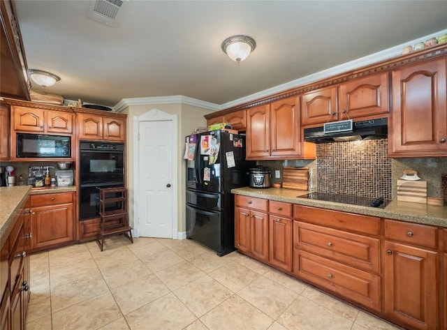 kitchen with black appliances, ornamental molding, backsplash, and light tile patterned floors