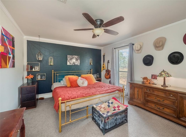 carpeted bedroom with ceiling fan and ornamental molding