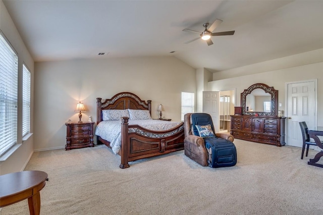 bedroom with ceiling fan, light colored carpet, and vaulted ceiling