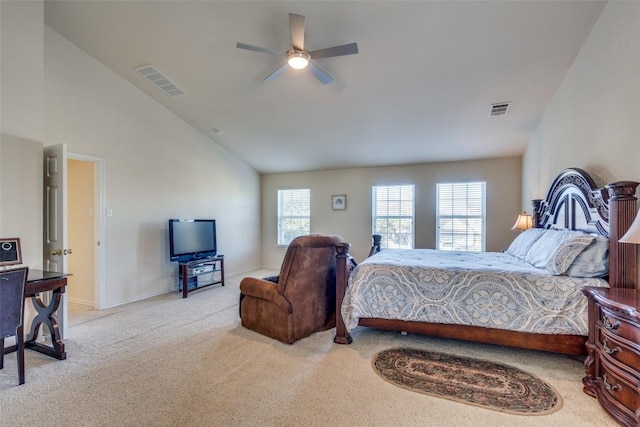 bedroom featuring ceiling fan, light carpet, and vaulted ceiling