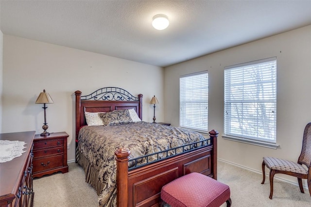 bedroom with light colored carpet