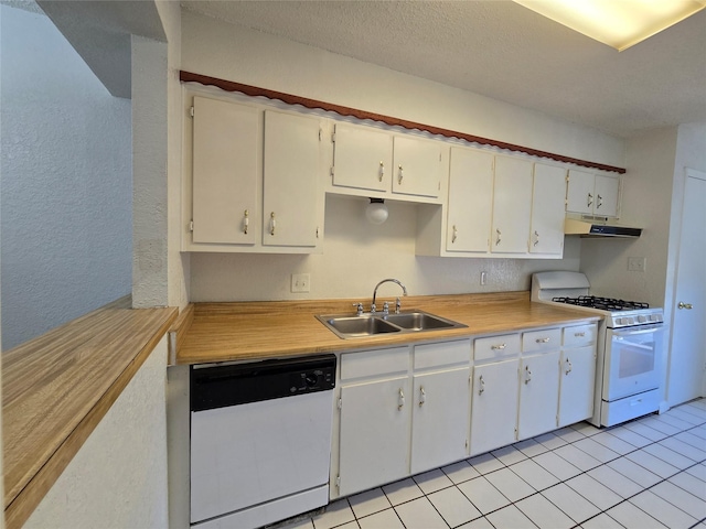 kitchen featuring light tile patterned floors, white appliances, a textured ceiling, white cabinets, and sink