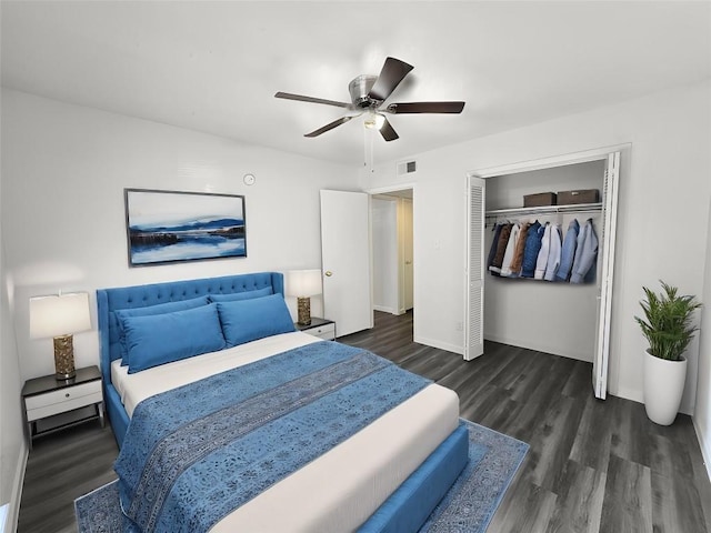 bedroom with ceiling fan, dark hardwood / wood-style floors, and a closet