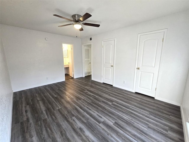 unfurnished bedroom with ceiling fan, connected bathroom, and dark hardwood / wood-style floors