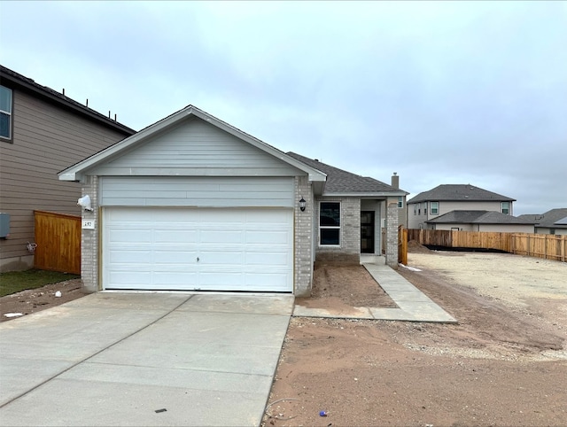 single story home with a garage