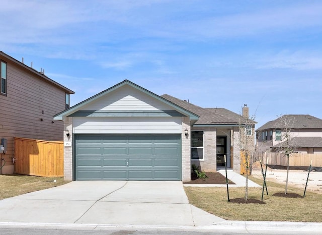 ranch-style home with brick siding, fence, and driveway