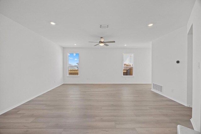 unfurnished room featuring light wood-type flooring, visible vents, ceiling fan, and recessed lighting