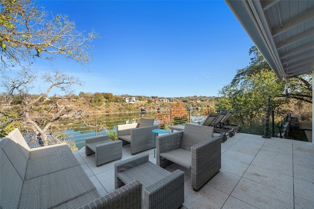 view of patio with a water view