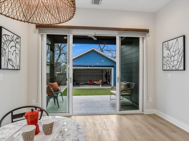 doorway with light hardwood / wood-style flooring