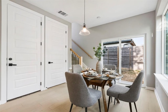 dining space featuring light hardwood / wood-style flooring