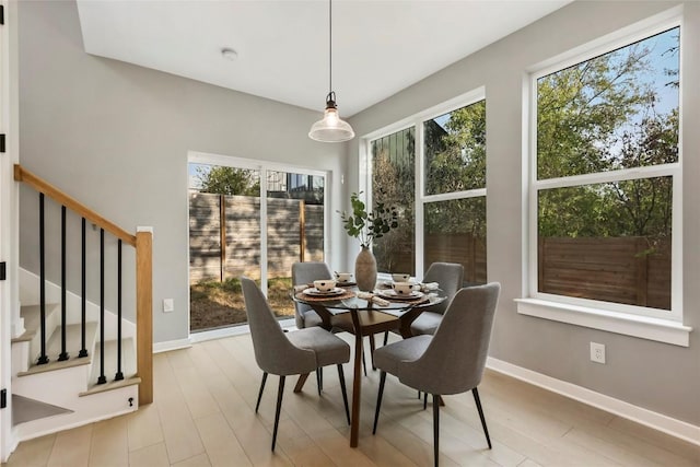 dining area with light wood-type flooring