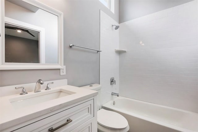 full bathroom featuring vanity, toilet, and tiled shower / bath