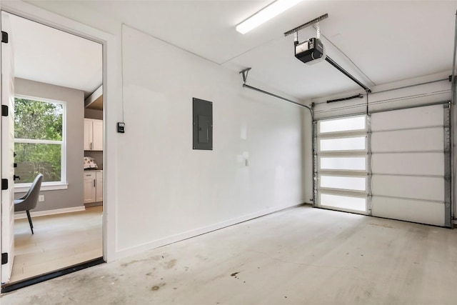 garage featuring electric panel and a garage door opener