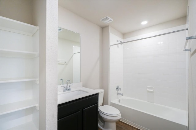 full bathroom with hardwood / wood-style floors, vanity, toilet, and shower / bathtub combination