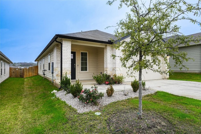 view of front of home featuring a porch, a garage, and a front lawn