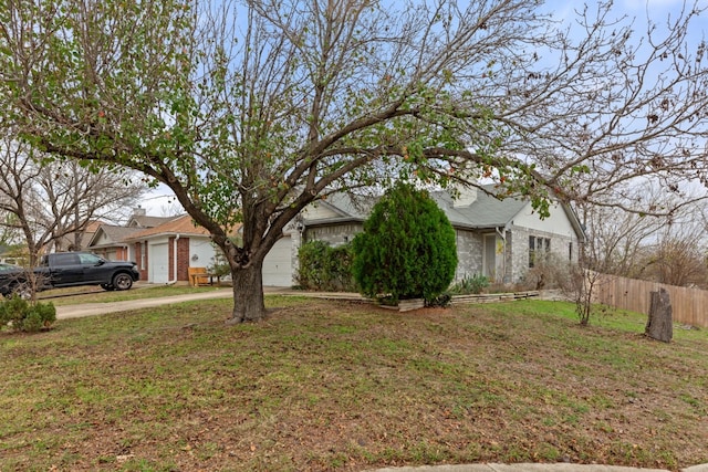 view of front of property with a garage and a front yard