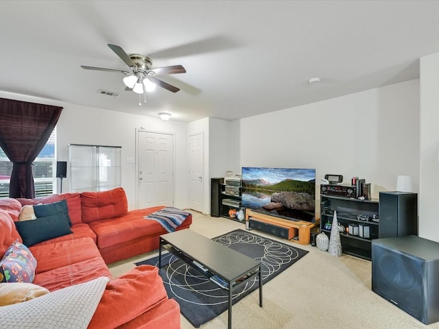 living room featuring light carpet and ceiling fan