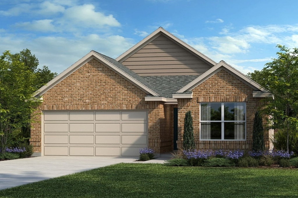 view of front of house with a front yard and a garage