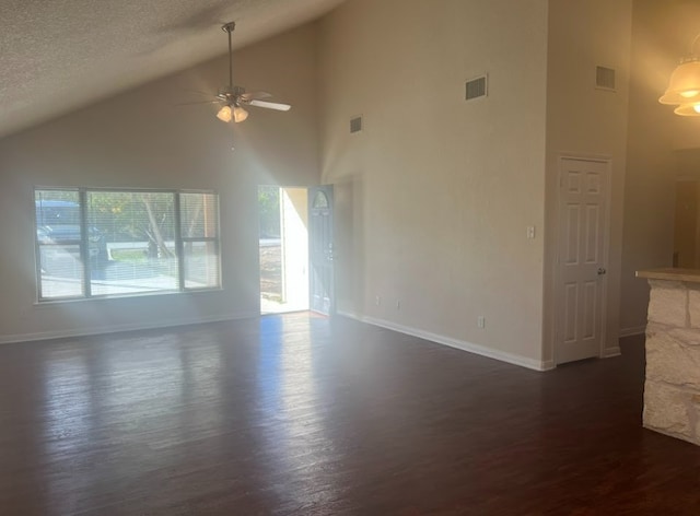 unfurnished living room featuring a textured ceiling, ceiling fan, dark wood-type flooring, high vaulted ceiling, and a fireplace