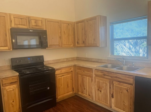 kitchen with dark hardwood / wood-style flooring, sink, light brown cabinetry, and black appliances