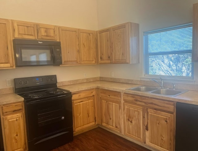 kitchen with dark hardwood / wood-style flooring, sink, black appliances, and light brown cabinets