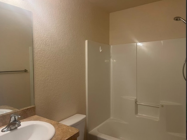 full bathroom featuring vanity, shower / bathing tub combination, and toilet