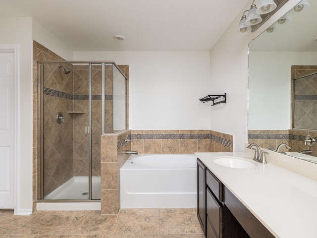 bathroom with vanity, tile patterned floors, and plus walk in shower